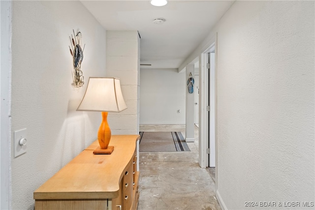 hallway featuring concrete floors