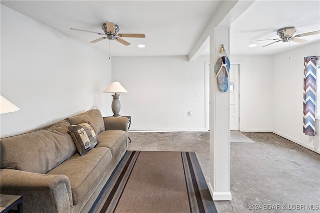 living room featuring concrete floors and ceiling fan