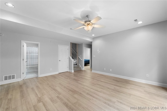 spare room featuring light hardwood / wood-style floors and ceiling fan