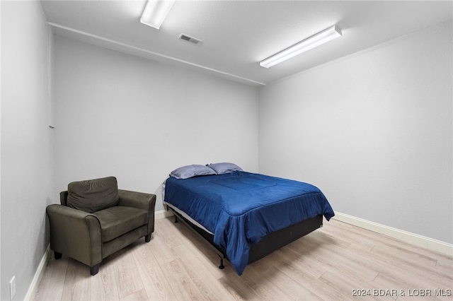 bedroom with light hardwood / wood-style flooring