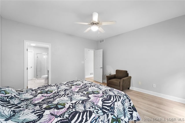 bedroom with ceiling fan, light hardwood / wood-style flooring, and ensuite bathroom