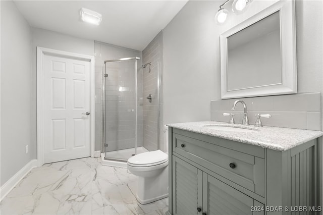 bathroom with toilet, an enclosed shower, and vanity