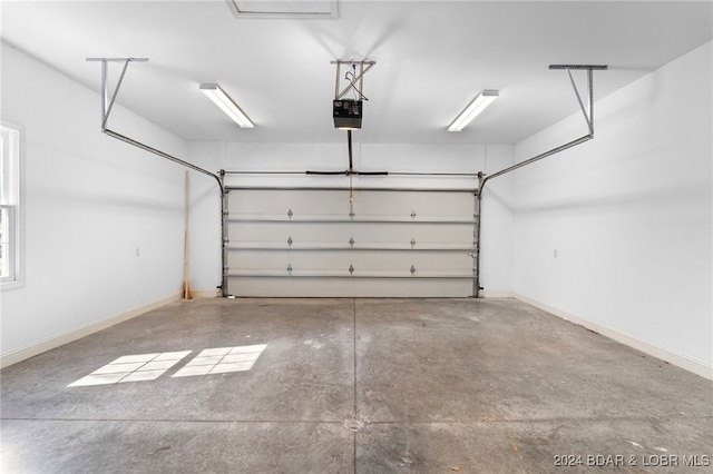 garage featuring a garage door opener