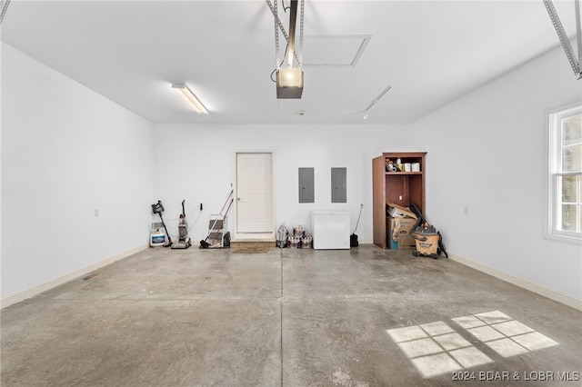 garage featuring a garage door opener and electric panel