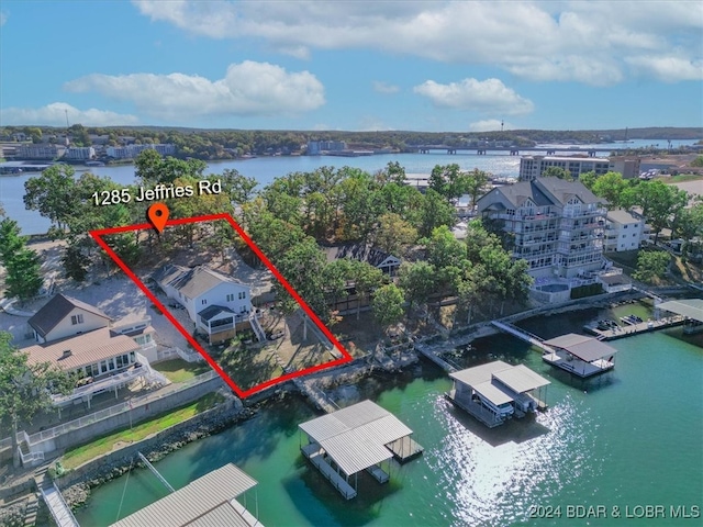 birds eye view of property featuring a water view