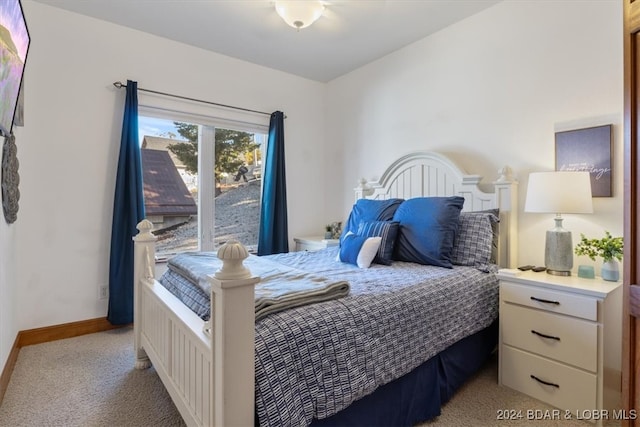 bedroom with light carpet