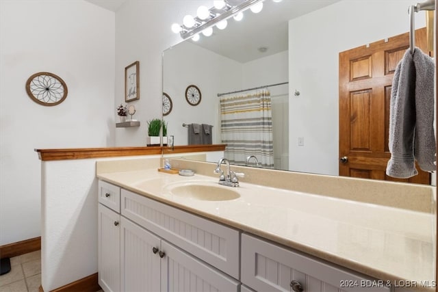 bathroom featuring vanity, a shower with curtain, and tile patterned floors