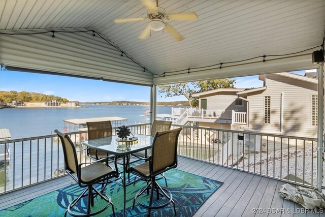 deck featuring a water view and ceiling fan