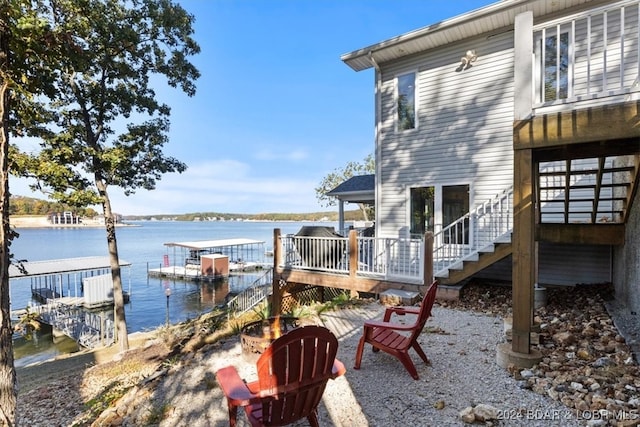 exterior space with a deck with water view