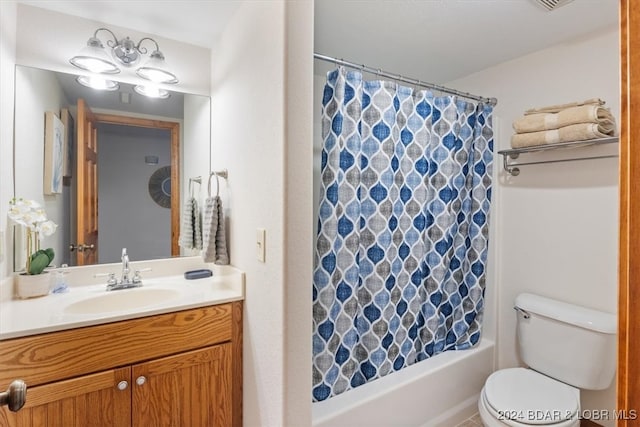 full bathroom featuring vanity, shower / tub combo with curtain, and toilet