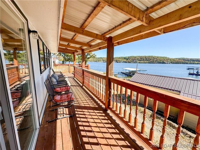 deck featuring a water view