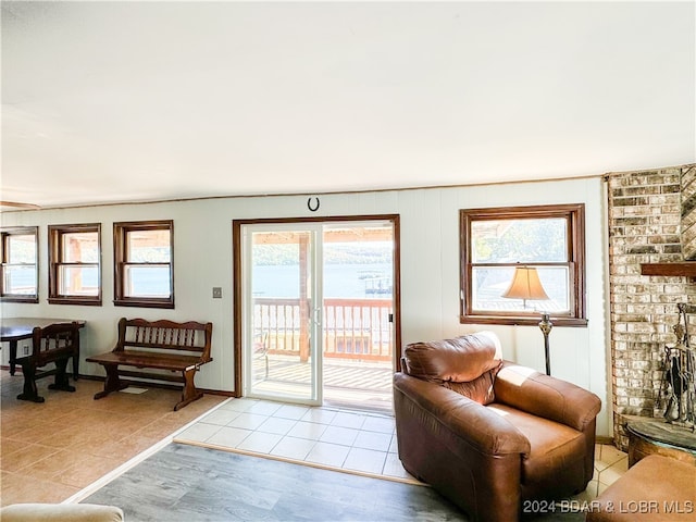 doorway featuring a fireplace and light tile patterned floors