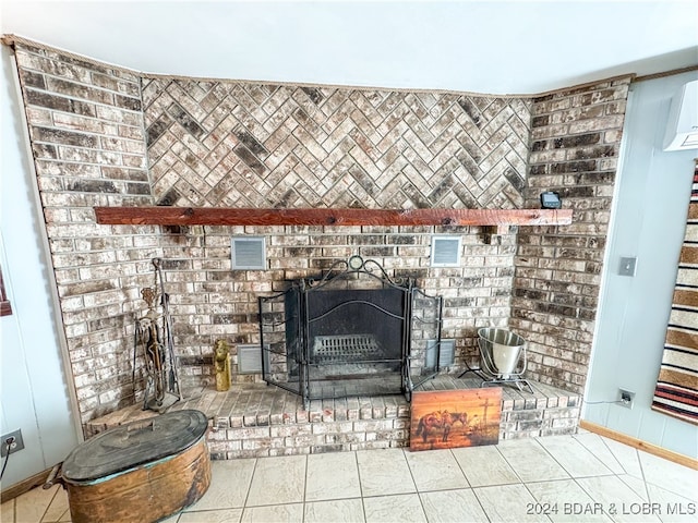 details with a brick fireplace, visible vents, and baseboards