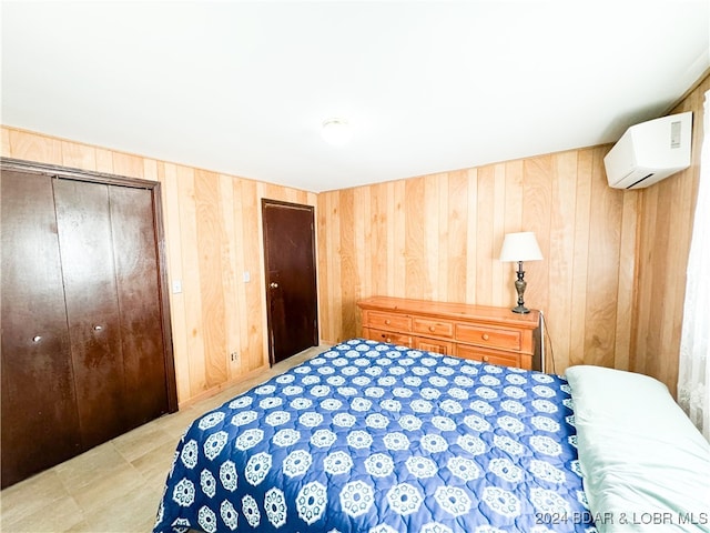 bedroom featuring a wall mounted AC and wooden walls