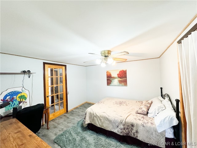 bedroom featuring light wood-type flooring, ceiling fan, and baseboards