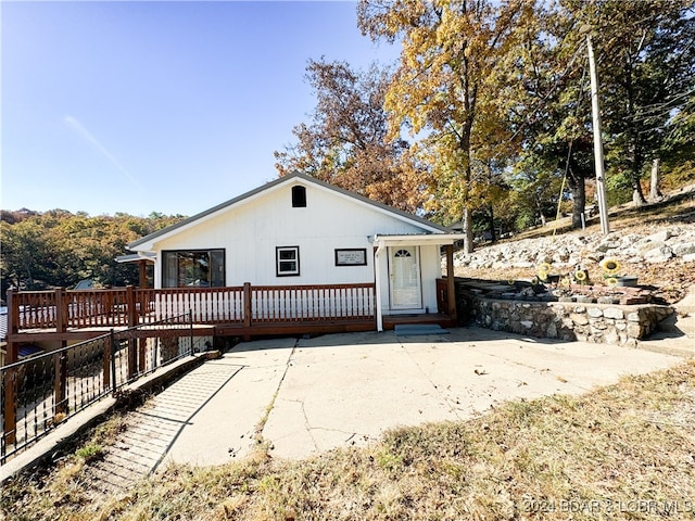 exterior space with fence and a deck