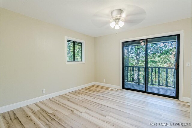 641 Porter Mill Springs Rd, Sunrise Beach, MO 65079 - unfurnished room featuring healthy amount of natural light, light wood-style flooring, and ceiling fan