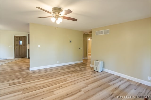 spare room with light hardwood / wood-style flooring and ceiling fan