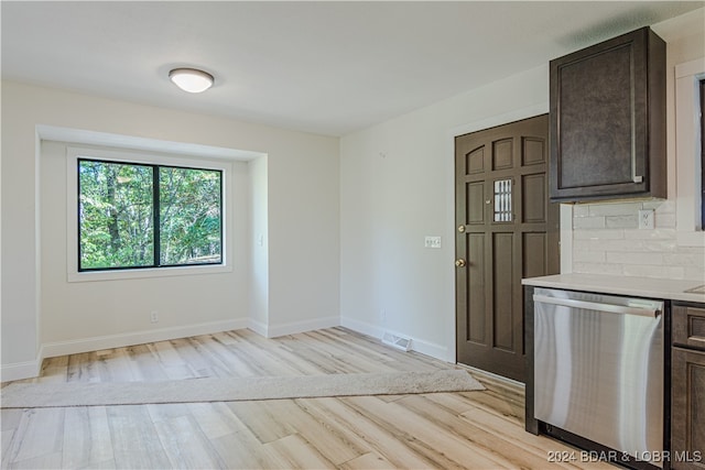 interior space with light hardwood / wood-style floors, tasteful backsplash, dark brown cabinets, and dishwasher