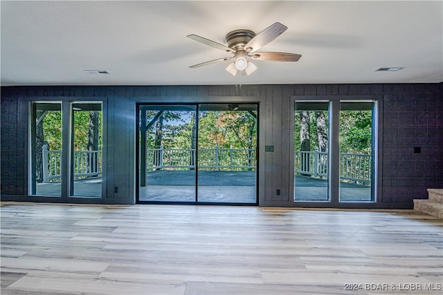 interior space featuring ceiling fan and light hardwood / wood-style flooring