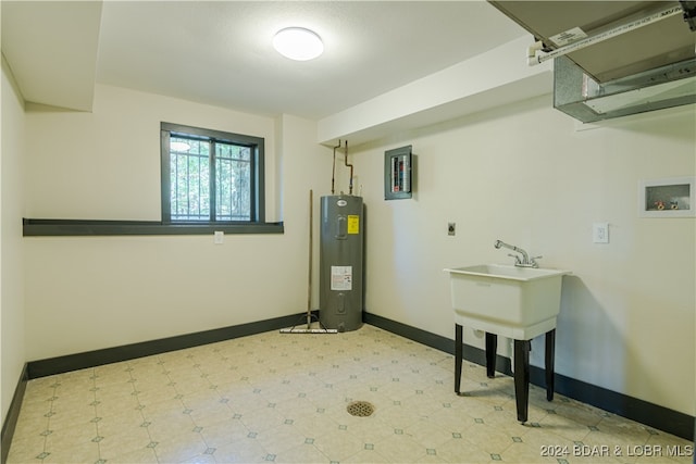 clothes washing area featuring hookup for a washing machine, water heater, and electric dryer hookup