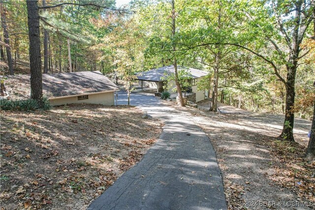641 Porter Mill Springs Rd, Sunrise Beach, MO 65079 - view of front of home with a wooded view