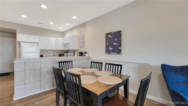4935 Robins Cir Unit 111, Osage Beach, MO 65065 - dining room featuring light wood-style floors, recessed lighting, visible vents, and baseboards