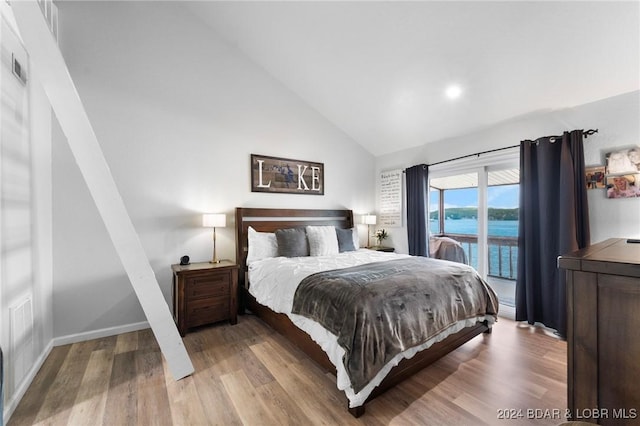 bedroom featuring lofted ceiling, access to exterior, baseboards, recessed lighting, and wood finished floors