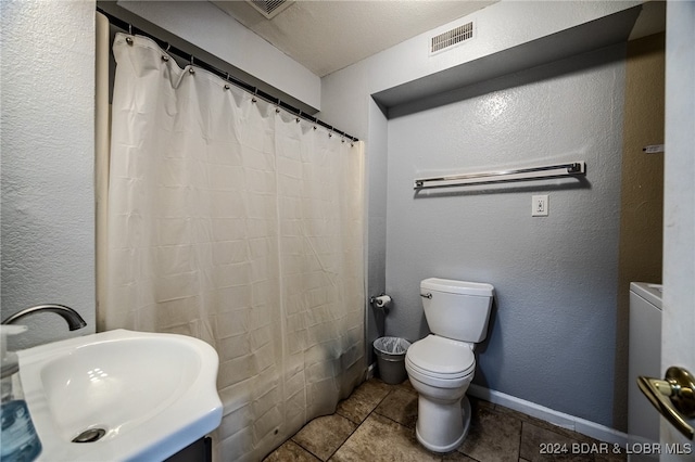 bathroom featuring a textured ceiling, toilet, tile patterned floors, a shower with curtain, and vanity