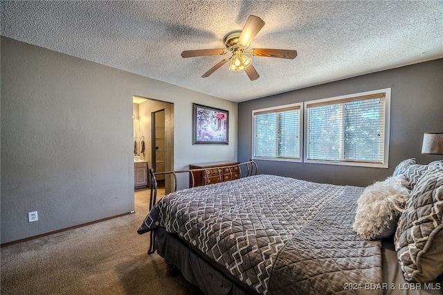 carpeted bedroom with a textured ceiling, ensuite bath, and ceiling fan