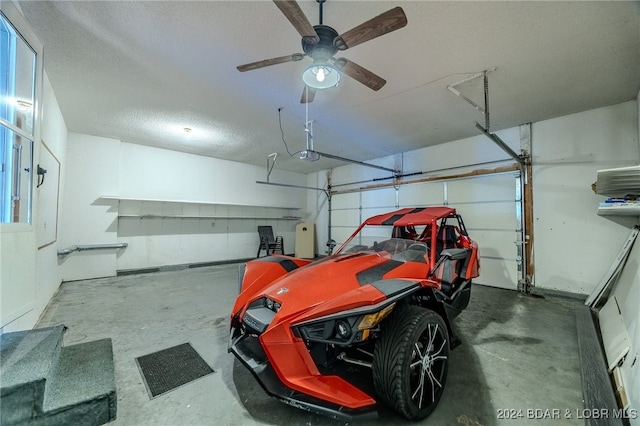 garage with a garage door opener and ceiling fan