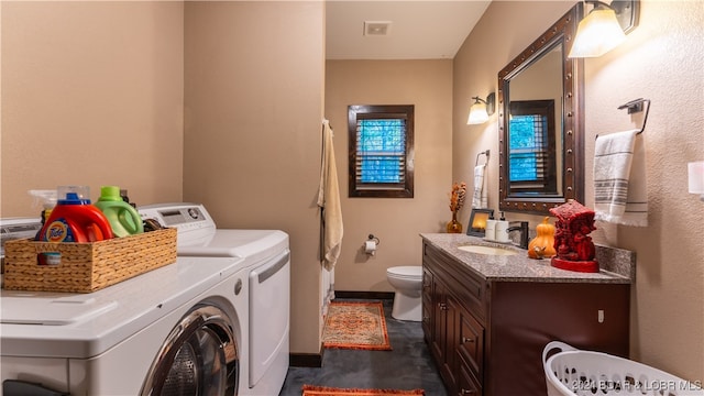 washroom featuring sink and washing machine and dryer