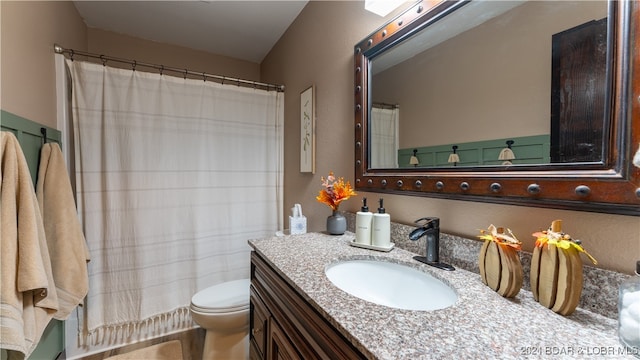 bathroom with vanity, toilet, and a shower with shower curtain