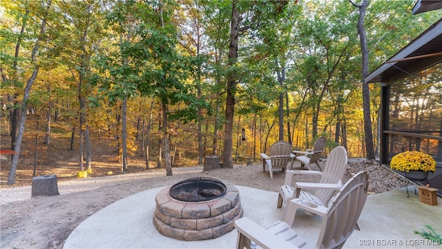 view of patio / terrace featuring an outdoor fire pit