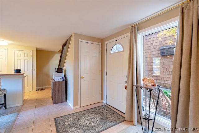 entryway with light tile patterned floors