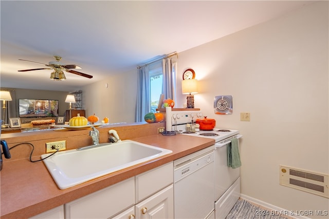 kitchen featuring white cabinetry, ceiling fan, sink, and white appliances