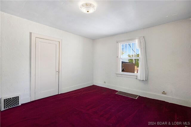 spare room with carpet