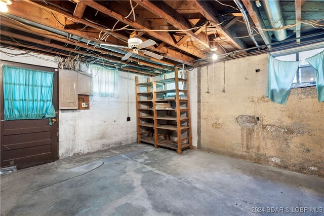 basement featuring ceiling fan