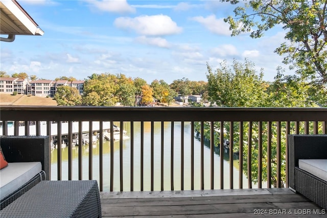 deck featuring a water view