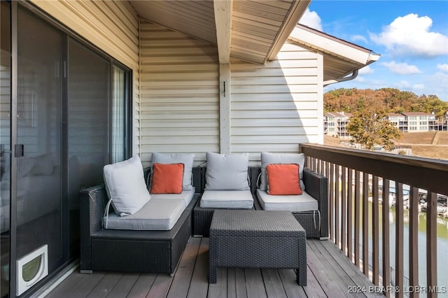 wooden terrace featuring an outdoor living space