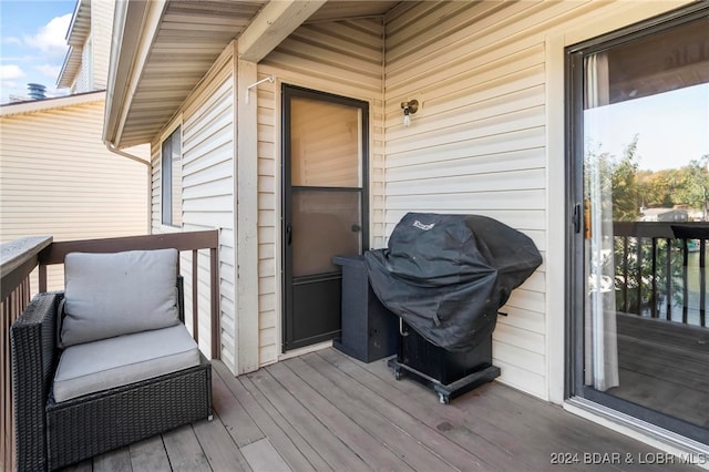 wooden terrace featuring grilling area