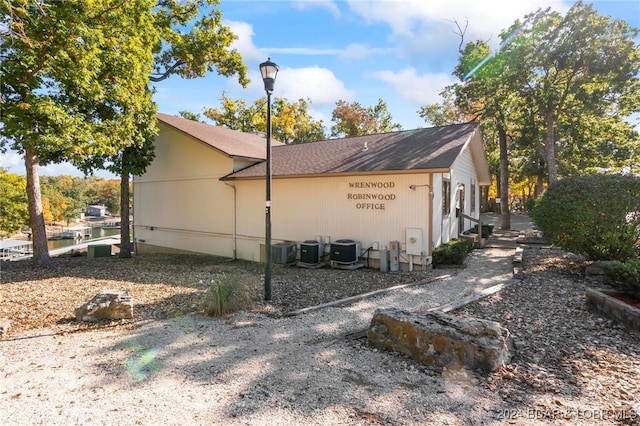 view of property exterior with central air condition unit