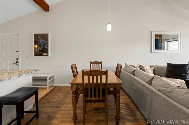 dining area with vaulted ceiling with beams and dark hardwood / wood-style floors