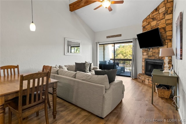 living room with beam ceiling, ceiling fan, high vaulted ceiling, wood-type flooring, and a fireplace