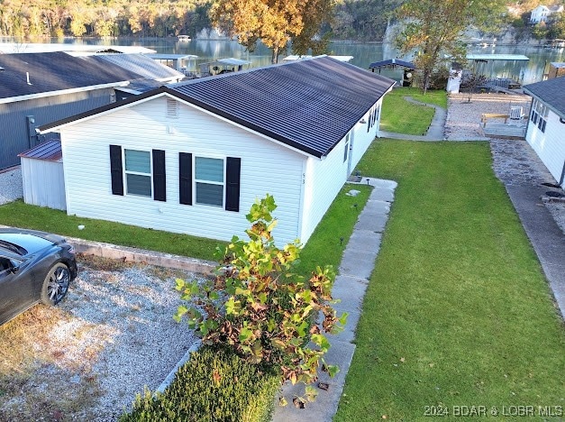 view of home's exterior with a yard