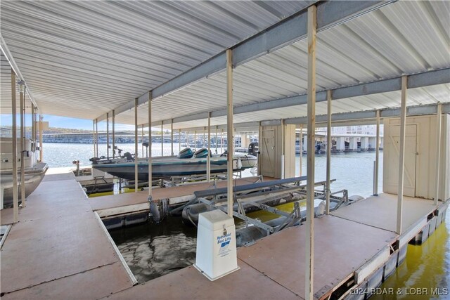 775 Winn Rd Unit 4I, Osage Beach, MO 65065 - dock area with boat lift and a water view