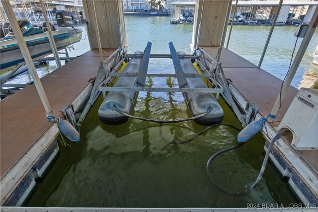 775 Winn Rd Unit 4I, Osage Beach, MO 65065 - dock area with boat lift and a water view