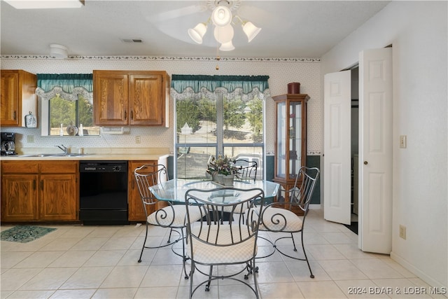 kitchen featuring ceiling fan, dishwasher, light tile patterned floors, and sink