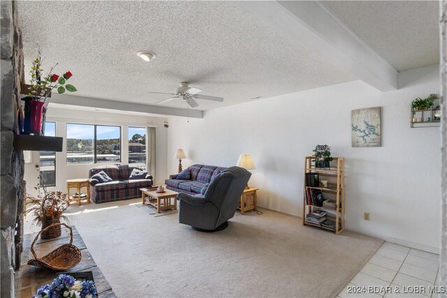 775 Winn Rd Unit 4I, Osage Beach, MO 65065 - tiled living room featuring a ceiling fan and a textured ceiling