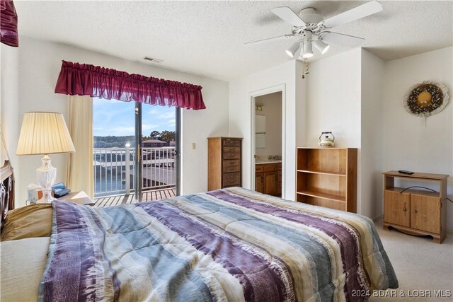 775 Winn Rd Unit 4I, Osage Beach, MO 65065 - bedroom with access to outside, carpet floors, a textured ceiling, ceiling fan, and ensuite bathroom